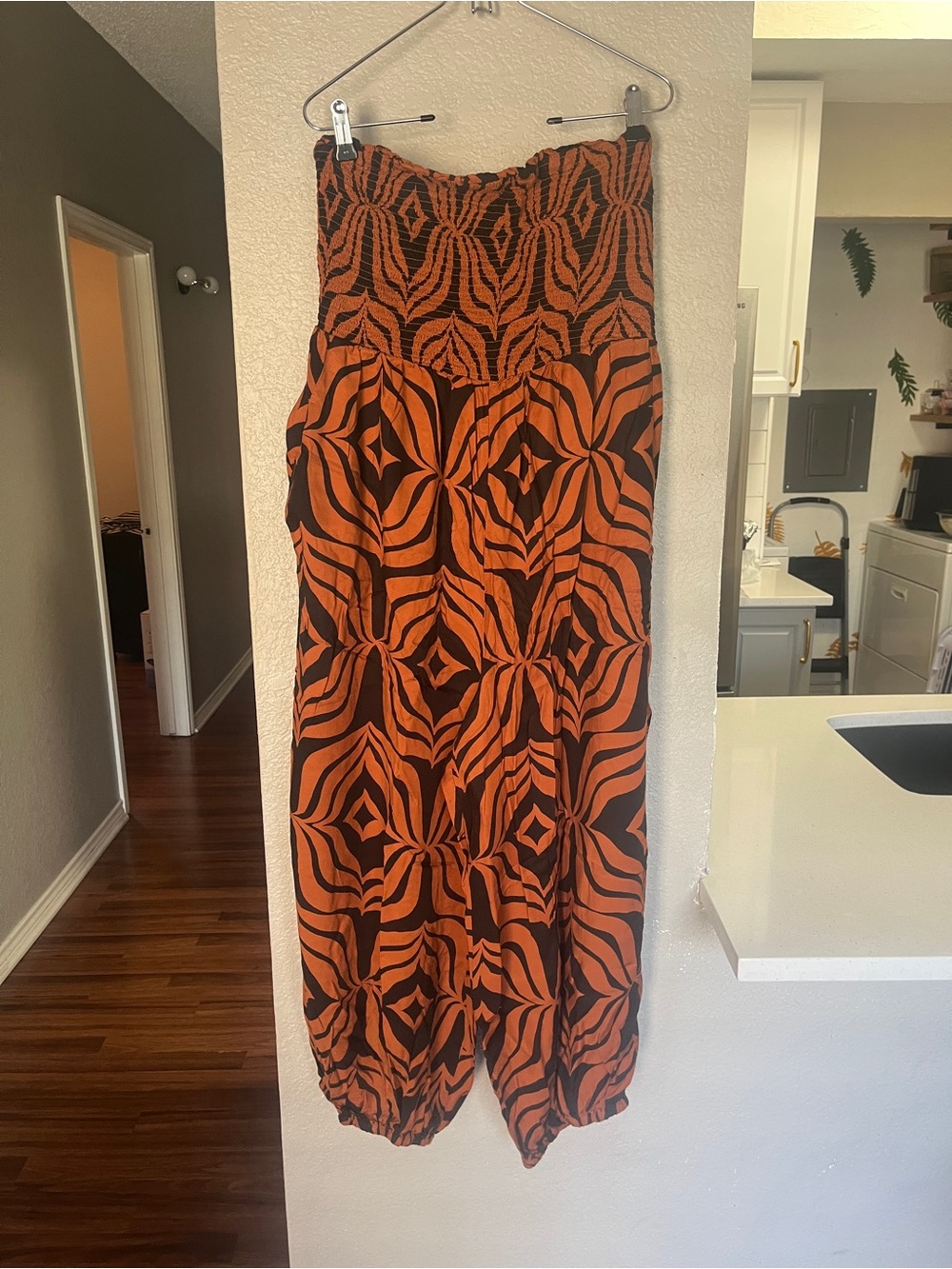 Anthropologie Orange and Black Geometric Smocked Jumpsuit